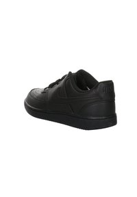 Zapatilla negra de cuero con puntera perforada, forma redondeada, suela plana negra y costura tonal. Presenta el logo de Nike grabado en el talón.