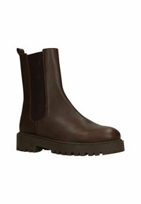 Bruine leren enkelboot met elastische zijkanten, ronde neus en dikke rubberen zool met een profielpatroon voor verbeterde grip.