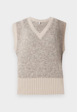 Gilet sans manches en tricot beige doux, avec un col en V, présentant un corps texturé et un ourlet côtelé contrastant dans une teinte beige plus clair.