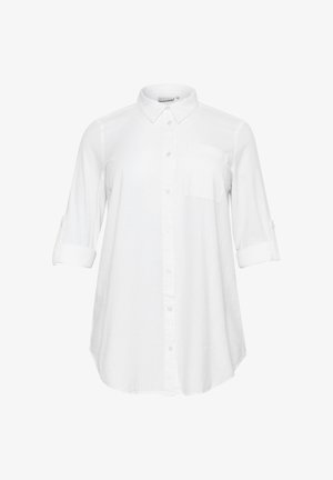 Fehér hosszú ujjú ing, gombolós, hegyes gallérral, mellzsebbel és felhajtott ujjakkal, melyeket gombos pántok rögzítenek.