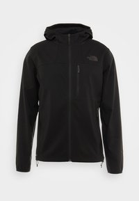 Veste softshell noire dotée d'une capuche, de poches zippées et d'un logo sur la poitrine. Le design est épuré avec une texture lisse.