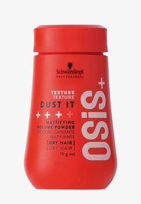 Contenant cylindrique rouge de Schwarzkopf OSiS+ Dust It, avec texte noir et accents blancs ; étiqueté comme poudre volume matifiante pour cheveux secs.