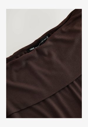 Leggings marron taille haute en tissu côtelé, dotés d'une ceinture lisse et d'un design ajusté pour une couverture intégrale.