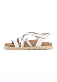 White and metallic silver strappy sandals with a cork footbed, thick jute sole, and rubber outsole. Adjustable ankle strap for fit.