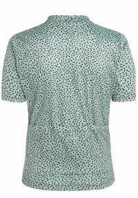 Chemise à manches courtes en vert menthe avec un motif de taches noires. Dispose d'un col classique et d'un ourlet droit. Texture douce.