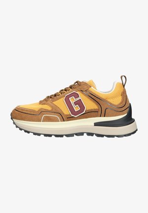 Brown and yellow sneaker with mesh fabric, suede accents, G logo, black heel support, and a thick, rugged sole. Features a lace-up design.