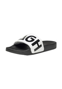 Chancla de slide en blanco y negro con una ancha tira blanca que presenta un texto negro en negritas, suela texturizada negra, acabado mate y diseño de punta abierta.