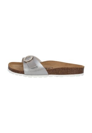 Silver slide sandal with a textured strap and decorative circular buckle. Features a cork footbed and white rubber sole.