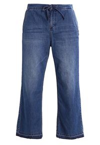 Pantalons en denim large bleu foncé avec une taille élastique et un cordon de serrage. Présente deux poches avant et une finition d'ourlet soigné.