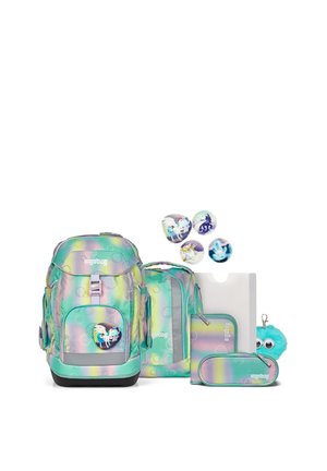 School backpack set with pastel rainbow colors, featuring unicorn-themed badges, a folder, pencil case, and a blue fuzzy keychain with eyes.