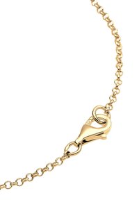 Goldfarbene Kette mit einem Karabinerverschluss, bestehend aus verbundenen ovalen Formen, mit einer glatten, glänzenden Textur und metallischem Finish.