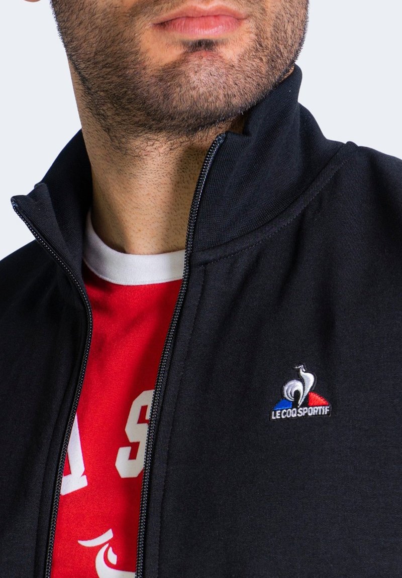 coq sportif ESSENTIELS - Chaqueta de entrenamiento - black/negro - Zalando.es