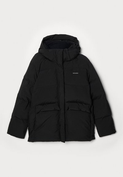 Black puffer jacket with a hood, featuring a front zipper, two large flap pockets, and "Halteweiler" logo on the left side. Soft texture.