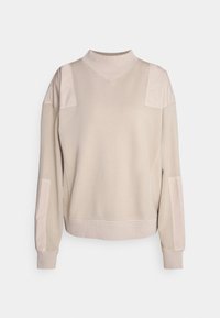 Beige Sweatshirt mit hohem Kragen, texturierten Schulterakzenten, gerippten Bündchen und entspanntem Schnitt. Weiches Material überall.