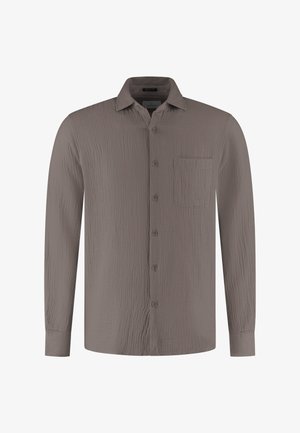 Pikkade varrukatega taupe värvi särk tekstuurse kangaga, esikäe nööbitav, terava kraega ja vasakul rinnataskuga.