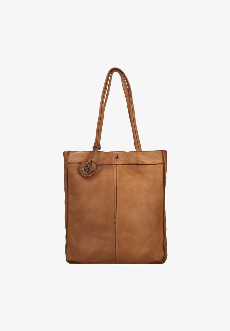 Sac fourre-tout en cuir marron avec deux longues poignées, design minimaliste, texture lisse et un accent circulaire arborant un emblème d'ancre.