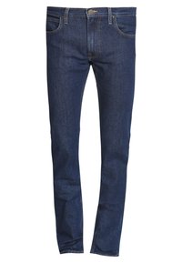 Tmavě modré džíny z denimu s úzkým střihem, pětiprvkovým designem a kontrastním prošitím. Mají zapínání na zip a kovové knoflíky.