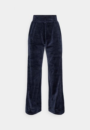 Pantaloni in velluto blu navy con vita alta, gambe larghe e un leggero lucido. Tessuto liscio, senza motivi visibili o accessori.