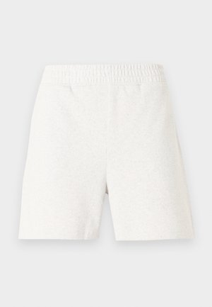 Shorts à taille élastique blanche avec un design simple sans motifs ni logos visibles, photographiés de dos.