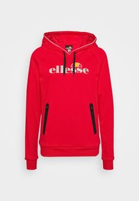 Sweat à capuche rouge avec cordons noirs, poches latérales zippées noires et logo "ellesse" blanc avec détail orange sur la poitrine.