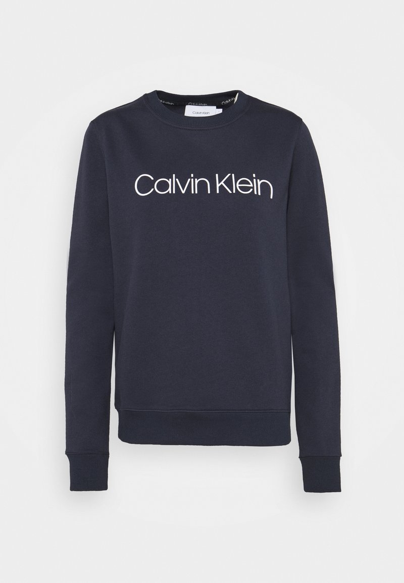 Sweat-shirt bleu marine à col rond avec manches longues et texte du logo blanc "Calvin Klein" centré sur la poitrine.