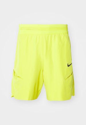 Shorts de sport jaunes fluo avec une taille flexible, deux poches latérales et un logo Nike noir en accent sur le bas à gauche à l'avant.