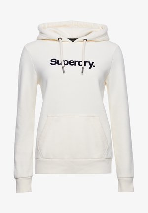 Sudadera con capucha color crema con bolsillo canguro, capucha ajustable con cordón y logo "Superdry" en azul marino en el pecho. Material de algodón suave.