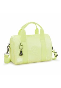 Neon keltainen nylon käsilaukku, jossa on kaksinkertaiset kahvat, säädettävä olkahihna ja koru. Laukussa on logo kohokuvioituna toisella puolella ja kiiltävä pinta.