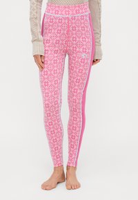 Rosa mønstrede leggings med et diamantdesign og blomster motiver. Utsmykket med lyseblå sidestriper. Laget av elastisk stoff.