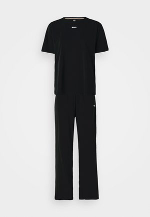Black short-sleeve T-shirt and matching pants made of soft fabric. T-shirt has "BOSS" logo in white, and pants feature a subtle logo detail.