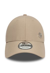 Beige adjustable baseball cap with a rounded crown, smooth fabric texture, and a silver New York Yankees logo on the front.