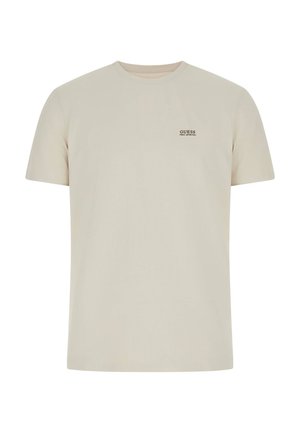 Kortærmet t-shirt i cremefarvet lavet af blød bomuld, med en lille sort "GUESS"-logo på brystet og rund hals.