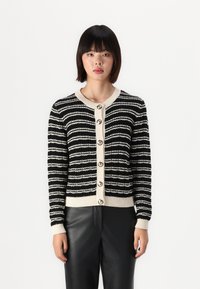 Zwart-wit gestreepte cardigan met een geribbelde crèmekleurige kraag en manchetten, voorzien van ronde knopen aan de voorkant en een gestructureerde stof.