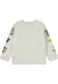 Světle šedá košile s dlouhým rukávem a různými barevnými grafickými potisky na obou rukávech. Uvnitř je ribbovaný límec a volný střih.