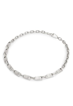 Silver metal chain necklace featuring rectangular links with a brushed finish and a lobster clasp closure. Smooth texture and geometric design.