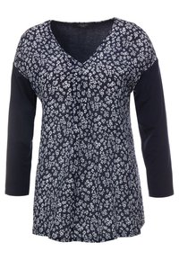 Laivansininen tunika, jossa on kolmemetriset hihat, etuosassa valkoinen kukkapainatus ja koko laivansininen hihat, valmistettu pehmeästä kankaasta.