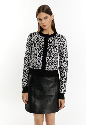 Cardigan in knit fabric featuring a purple and black leopard print. Black ribbed cuffs and hem, with a button-up front design.