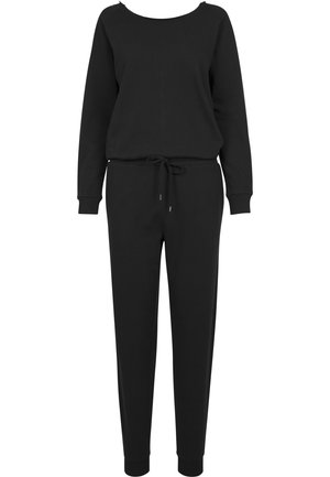 Combinaison en sweat noir avec des manches longues, coupe décontractée, col rond, taille élastique, cordon de serrage et poignets ajustés aux chevilles. Texture de tissu douce.