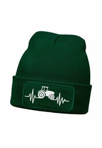 Green knit beanie with ribbed texture, featuring a white tractor graphic and heartbeat line on a rectangular patch.