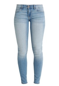 Ljusblå smala jeans i denim. Har en klassisk femfickdesign, bältesöljer och subtil blekning längs benen.