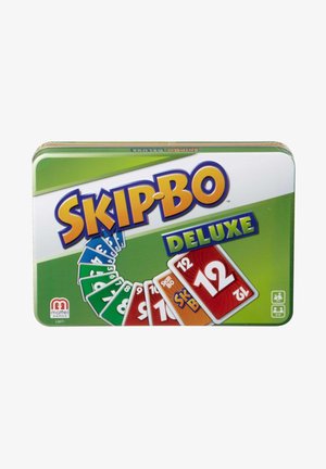 Metal tin featuring "SKIP-BO DELUXE" logo in bold yellow, green background, displaying colorful number cards in a fan arrangement.