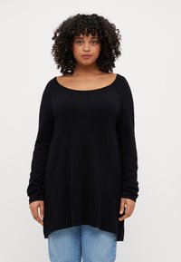 Black long-sleeve top with a wide scoop neckline and a relaxed fit, featuring a straight hemline and soft, smooth texture.