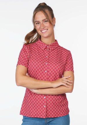 Short-sleeved red shirt with a collar, featuring a wave pattern in pink and yellow. Buttoned front and a relaxed fit, made of lightweight fabric.