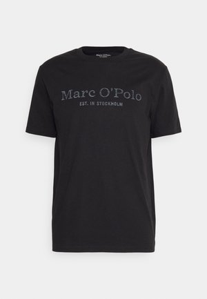 Black cotton t-shirt featuring crew neckline and short sleeves. Front displays "Marc O'Polo" and "EST. IN STOCKHOLM" in contrasting print.