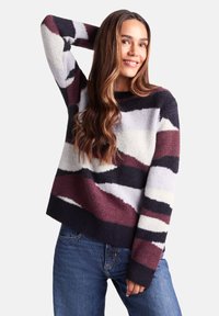 Multicolored knit sweater with wavy patterns in burgundy, dark navy, light grey, and white. Features a round neckline and ribbed cuffs.