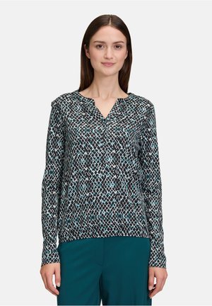 Zwart en turquoise gemêleerde blouse met lange mouwen, V-hals, zachte stof en een relaxte pasvorm. Gepaard met teal broek.