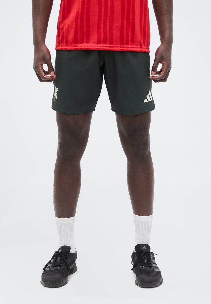 adidas MANCHESTER UNITED TIRO TRAVEL SHORTS - Club wear - jungle ink