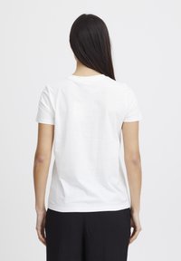 Short-sleeve white cotton t-shirt with a round neckline, featuring a smooth texture and a basic design, shown from the back.