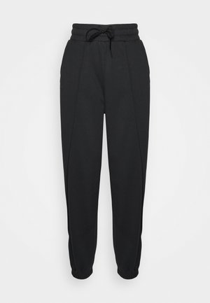 Black sweatpants made of soft fabric, featuring an elastic waistband with drawstring, tapered legs, and side pockets.