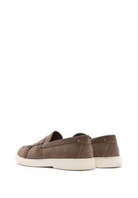 Brown suede slip-on shoes with a low profile, rounded toe, and contrasting white rubber sole; features minimal stitching accents.
